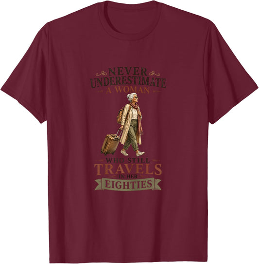 Never Underestimate a Woman who Still Travels in her 80's T-Shirt - T-Shirt | Maroon