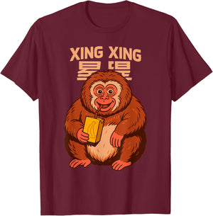 Xingxing The Monkey drinking Banana Juice T-Shirt - T-Shirt | Maroon