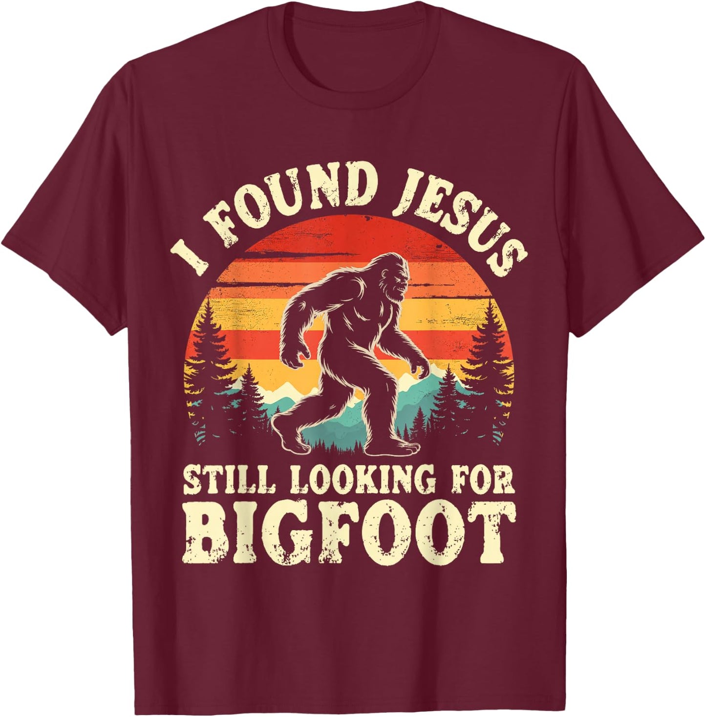 Funny I God Found Jesus Still Looking for Bigfoot Christian T-Shirt - T-Shirt | Maroon