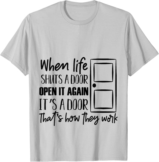 when life shuts a door open it again that's how they work T T-Shirt - T-Shirt | Ash