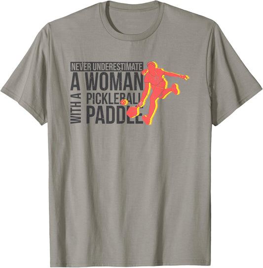 Never underestimate a woman with a pickleball paddle shirt T-Shirt - T-Shirt | Sand