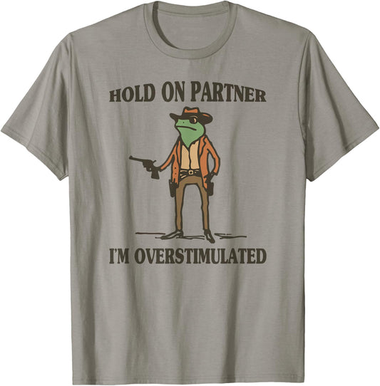 Hold On Partner I'm Overstimulated Frog Cowboy T-Shirt - T-Shirt | Sand
